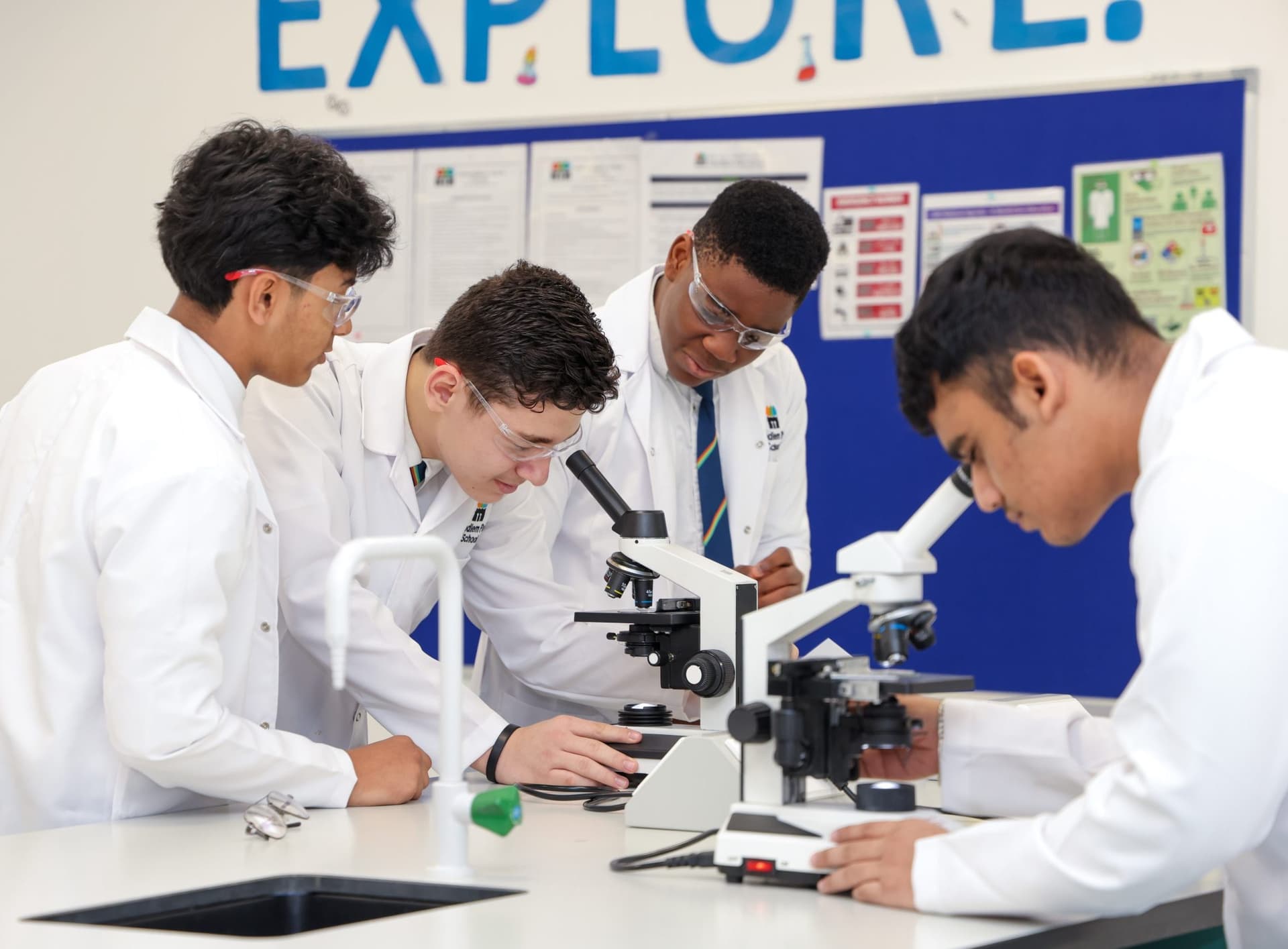 Students using microscopes in the science lab